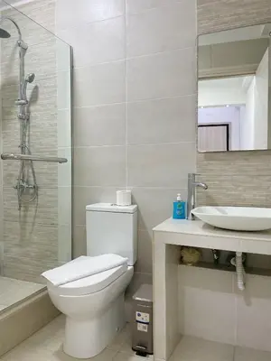 a bathroom with a toilet and a sink and a shower at Bluebay Cozy Aparment in Athens