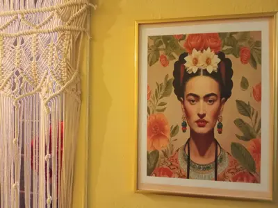 a painting of a woman with a flower on her head at The Happy Town House , 300m from the metro station in Athens
