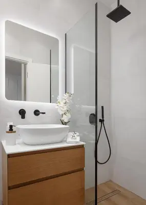 a bathroom with a sink and a mirror at Athena's Lemon Grove Glyfada in Athens