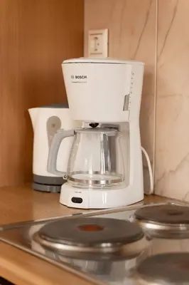 a coffee maker sitting on top of a counter at Spacious house with seaview in Porto Rafti