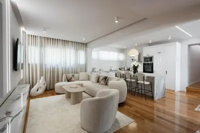 a living room and kitchen with a couch and a table at Acropolis Soul in Athens