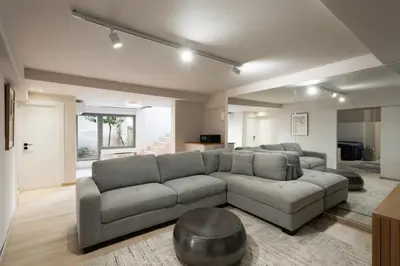 a living room with a large couch and a table at Acropolis Soul in Athens