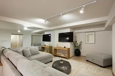 a living room with a large couch and a table at Acropolis Soul in Athens