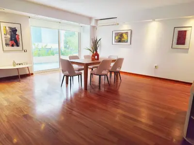 a dining room with a table and chairs at Adelos II Glow Villa 5BR 360m -Elevator-Rooftop in Athens