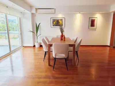 a dining room with a table and chairs at Adelos II Glow Villa 5BR 360m -Elevator-Rooftop in Athens