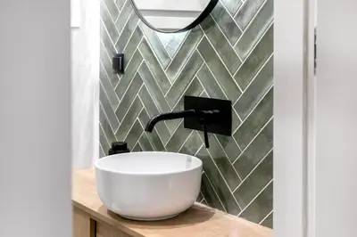 a bathroom with a bowl sink and a mirror at Lyndon Deluxe Studio - Athens Modern Escape in Athens