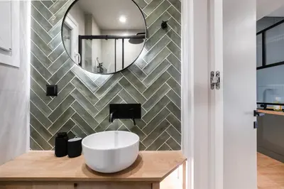 a bathroom with a sink and a mirror at Lyndon Deluxe Studio - Athens Modern Escape in Athens