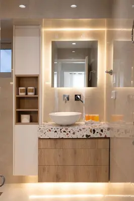 a bathroom with a sink and a mirror at Seaside Elegance Brand New 2BD Luxury Stay in Athens