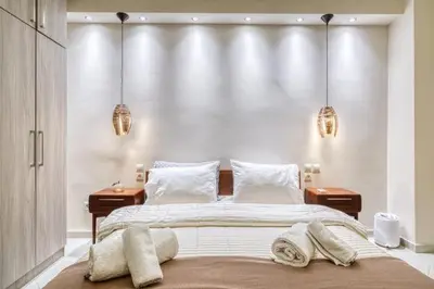 a bedroom with a large bed with two night stands at So36 Filoxenia Place Like Home Kolonaki- next to metro and center in Athens