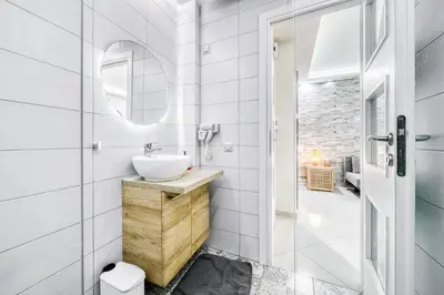 a bathroom with a sink and a mirror at So36 Filoxenia Place Like Home Kolonaki- next to metro and center in Athens
