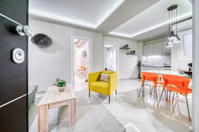 a kitchen and dining room with orange chairs and a table at So36 Filoxenia Place Like Home Kolonaki- next to metro and center in Athens