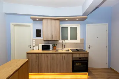 a kitchen with a sink and a microwave at Central Athens Charm in Athens