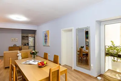 a dining room and kitchen with a table and chairs at Central Athens Charm in Athens