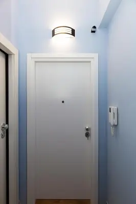 a white door with a light on top of it at Central Athens Charm in Athens