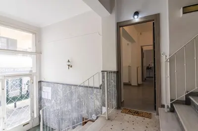 a hallway with a glass door in a building at Daedalus Minimal 1bedroom Bliss in Athens