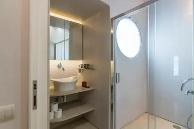 a bathroom with a sink and a shower at Culture and Luxury 2bed Flat with Acropolis Views in Athens