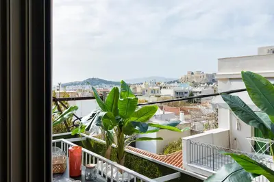 a balcony with a view of a city at Culture and Luxury 2bed Flat with Acropolis Views in Athens