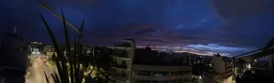 a view of a city at night at Tete's Acropolis View Penthouse in Athens