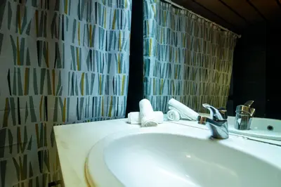 a bathroom with a sink and a mirror at Kolonaki Haven - 2 BR, Kolonaki in Athens