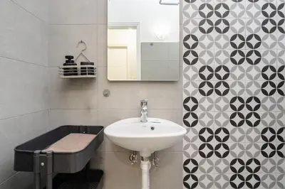 a bathroom with a sink and a mirror at Cozy 1 BR Apt in Koukaki in Athens