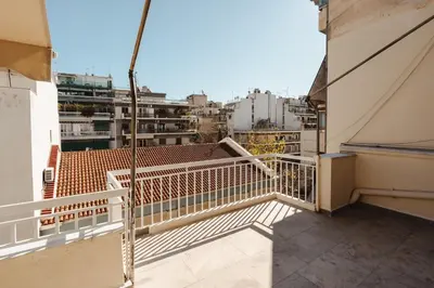 a balcony with a view of a city at Cozy 1 BR Apt in Koukaki in Athens