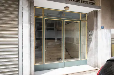a glass door on the side of a building at Ant19- Stylish 1BR with Balcony in Central Athens in Athens