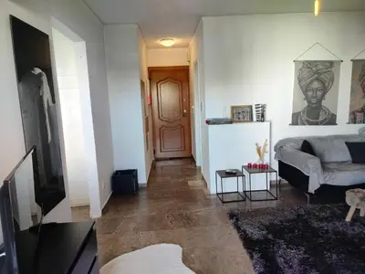 a living room with a couch and a door at Emily's luxury apartment in Vari