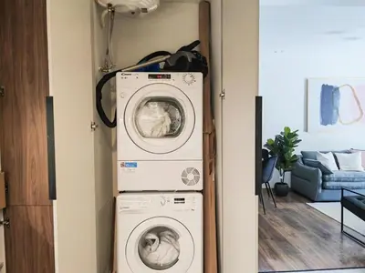 a washer and dryer in a living room at Ako 25 - stay close to the Acropolis in Athens