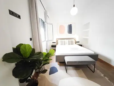 a room with a bed and plants in it at Sav12 - Cozy home in Athens in Athens