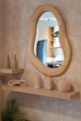a mirror on a shelf with candles on it at LIV - Seaside Getaway in Glyfada in Athens