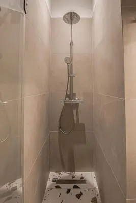 a bathroom with a shower with a toilet in it at Retro Luxury Apartment in Athens
