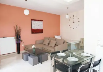 a living room with a couch and a table at ZenPort in Piraeus