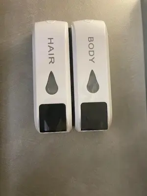 a white remote control with the numbers on it at Brick house in Athens