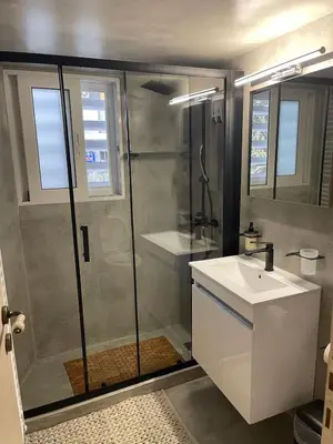 a bathroom with a shower and a sink at Brick house in Athens