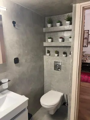 a bathroom with a toilet and a sink at Brick house in Athens