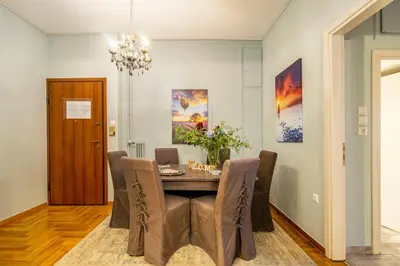 a dining room with a table and chairs at Little house in the city in Athens