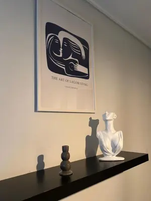 a shelf with a vase and a picture on a wall at Acropolis Ray of Light - Spacious Flat - Stunning views in Athens