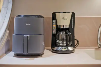 a coffee maker sitting next to a coffeemaker on a counter at Otto Centro in Athens