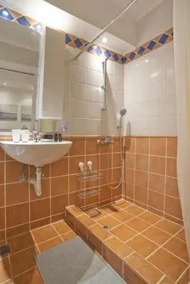a bathroom with a sink and a shower at Otto Centro in Athens