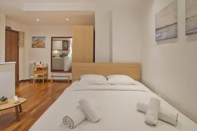 a bedroom with a large white bed with two pillows at Otto Centro in Athens