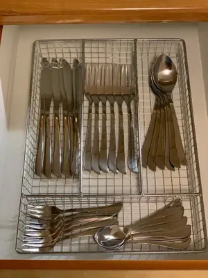 a metal rack with utensils on a counter at Dafni Athens loft in Athens