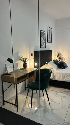 a bedroom with a desk and a bed and a bed at Sophistic Athens in Athens