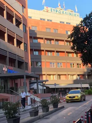 a yellow car parked in front of a building at Bella's apartment in Athens