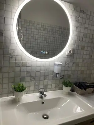 a bathroom with a sink with a large mirror at Bella's apartment in Athens