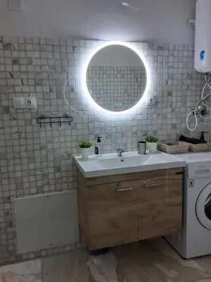 a bathroom with a sink and a mirror at Bella's apartment in Athens