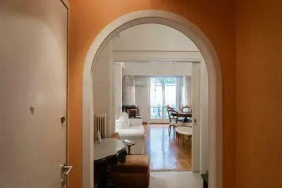an archway in a room with a living room and a living room at Premium Plaka Apartment in Historic Athens City in Athens