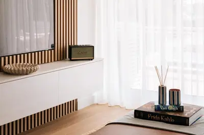 a room with a table with a book and a window at 1BD SV Beach Condo with Pool in Athens
