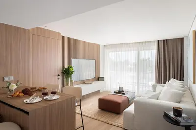 a living room with a white couch and a table at 1BD SV Beach Condo with Pool in Athens