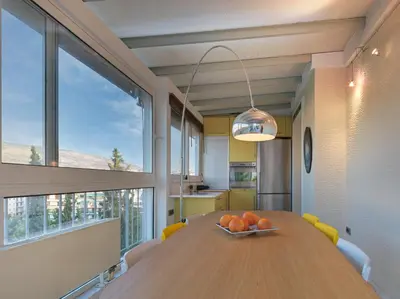 a dining room with a wooden table with oranges on it at AthensView Bird's Eye Penthouse with Acropolis view -ONE BEDROOM FLAT in Athens