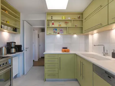 a kitchen with green cabinets and a sink at AthensView Bird's Eye Penthouse with Acropolis view -ONE BEDROOM FLAT in Athens